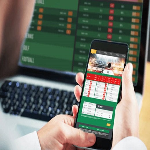 A man placing bets on sports online.