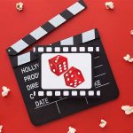 Movie track, popcorns, and two dice
