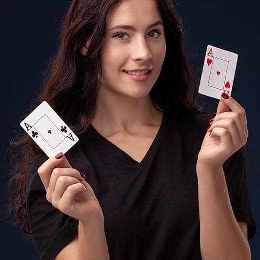 Nice-looking girl holding aces
