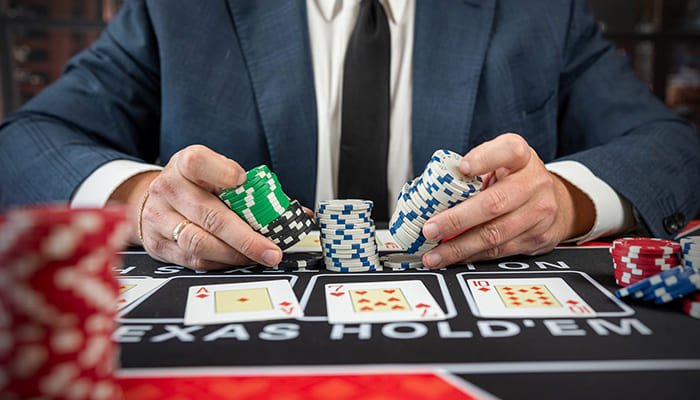 Texas Hold'em player with casino chips and cards