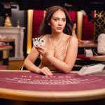 Blackjack dealer holding cards