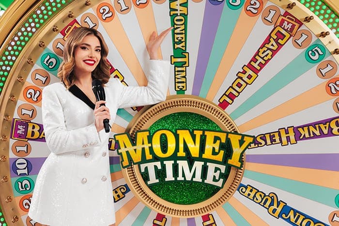 Money Time game show presenter in front of the wheel